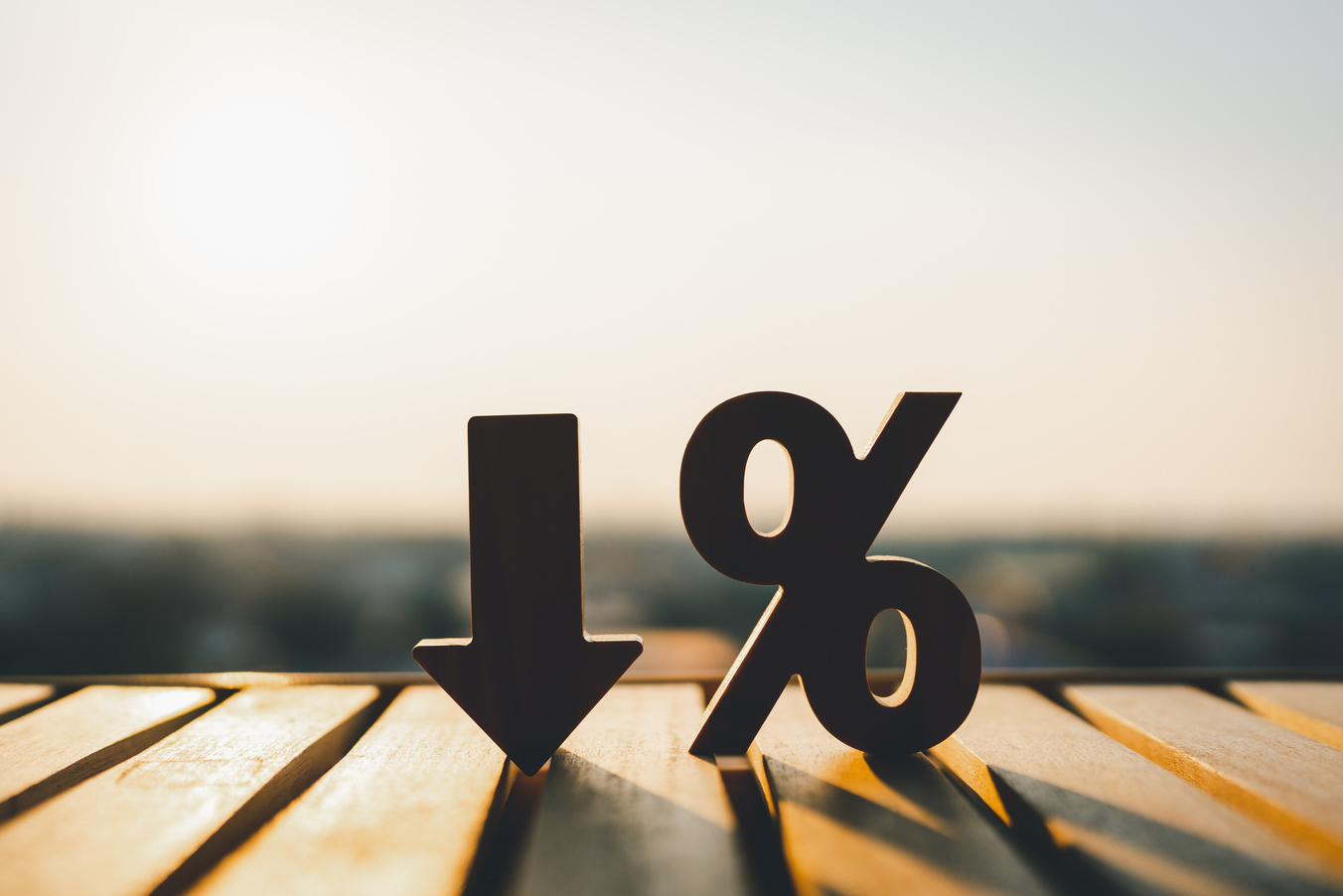 Percentage model and down arrow with evening sky Key concepts for success, methods, systems of raising or lowering Fed interest rates to correct inflation concepts.